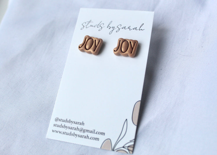 Embossed JOY Studs